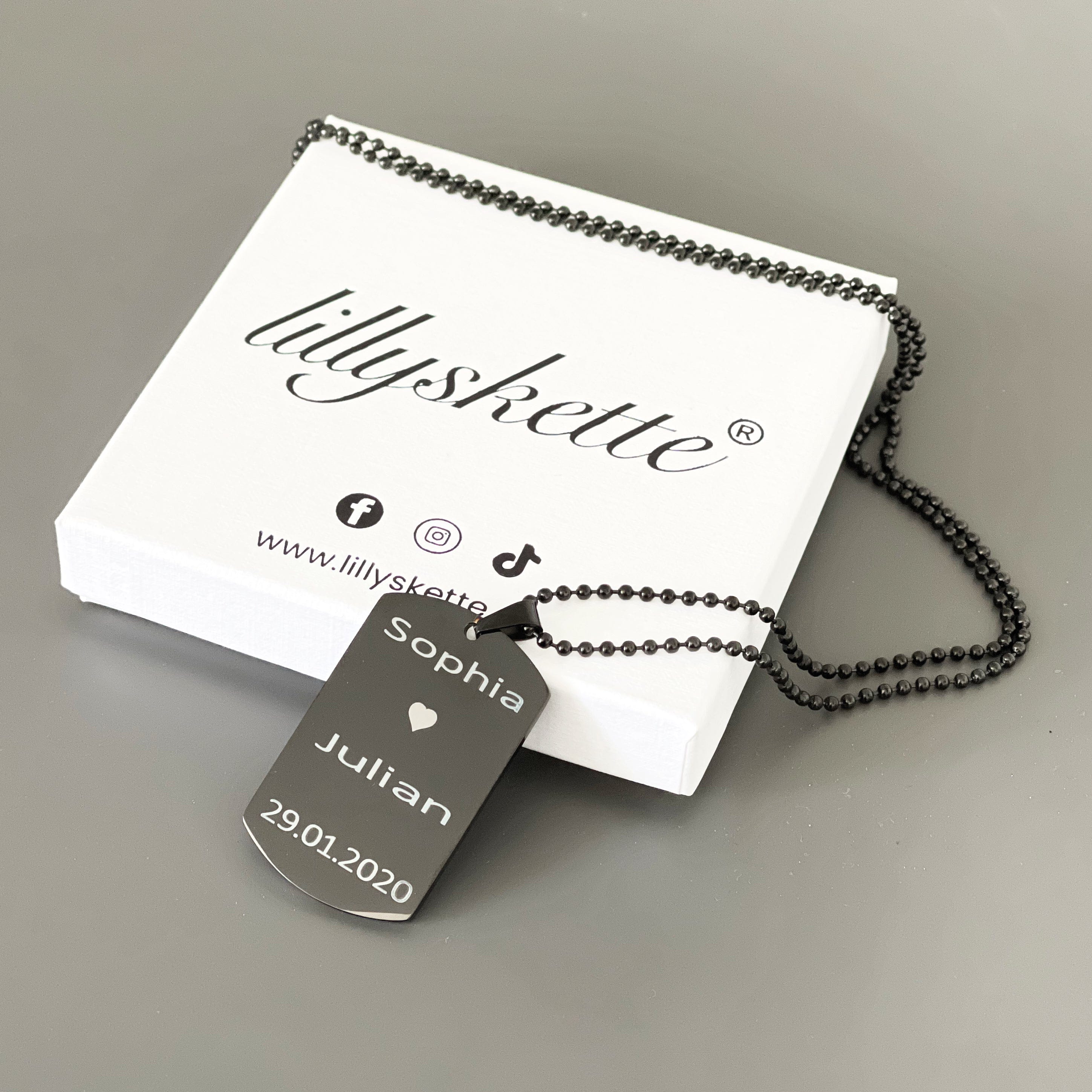 Dog tag schwarz und mit gravur.